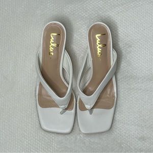 White Lulu’s kitten heels